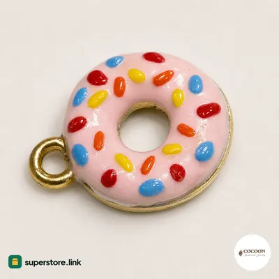 Donut charm with pink icing, multicolour sprinkles and gold ring
